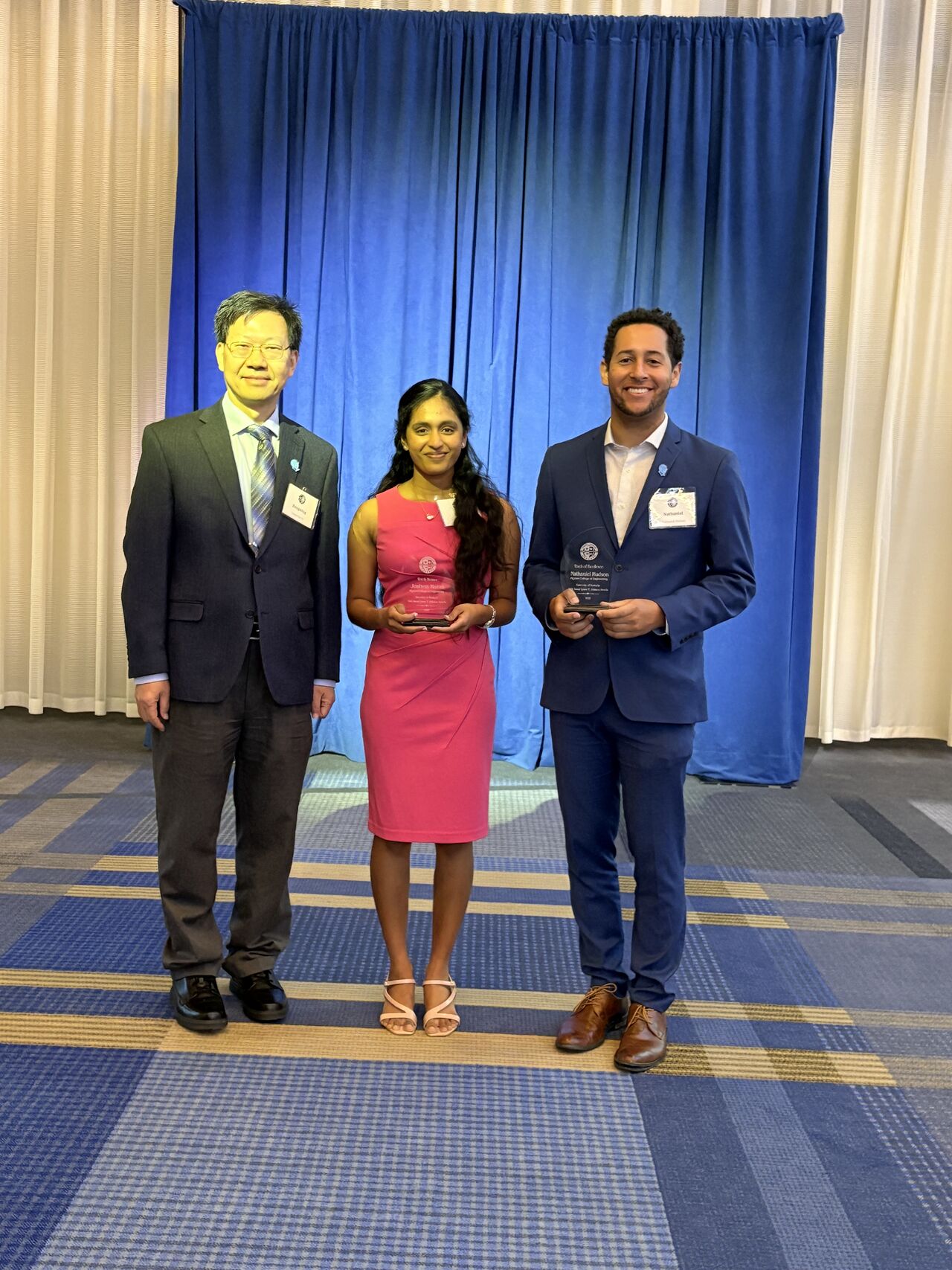 Picture of Dr. Nathaniel Hudson attending the 34th Lyman T. Johnson Award Lucheon to receive the Torch of Excellence award, alongside Joshna Kurra who received the Torch Bearer award.
